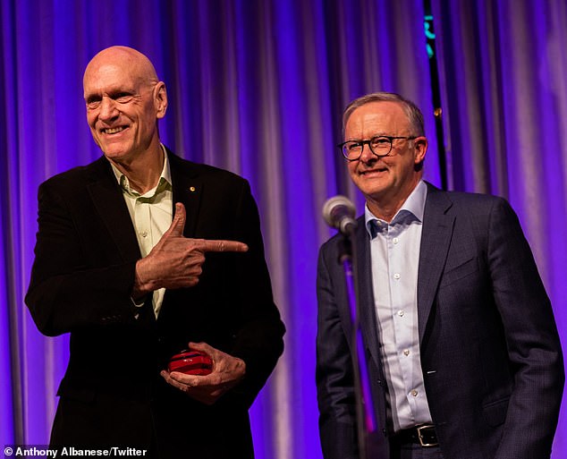 Prime Minister Anthony Albanese has been called Midnight Oil's biggest fan and presented them with an award for excellence in the community.  Mr Albanese is pictured right with Midnight Oil singer and former Labor MP Peter Garrett