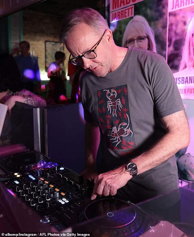 Anthony Albanese (pictured doing a DJ set) has been criticised by users who branded him 'out of touch' as ​​millions of Aussies struggle during a cost of living crisis