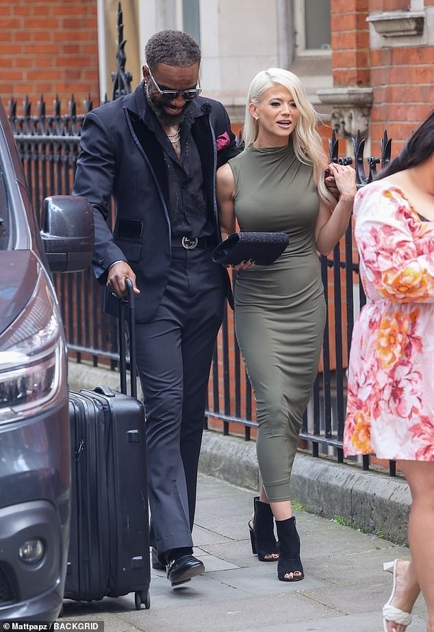 The actor was pictured with an arm around the former soap star as they arrived for the star-studded event at London's Grosvenor Hotel.