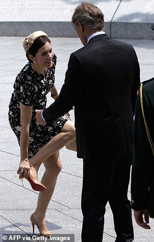Mary seemed to laugh it off as she put the Christian Louboutin shoe back on her foot