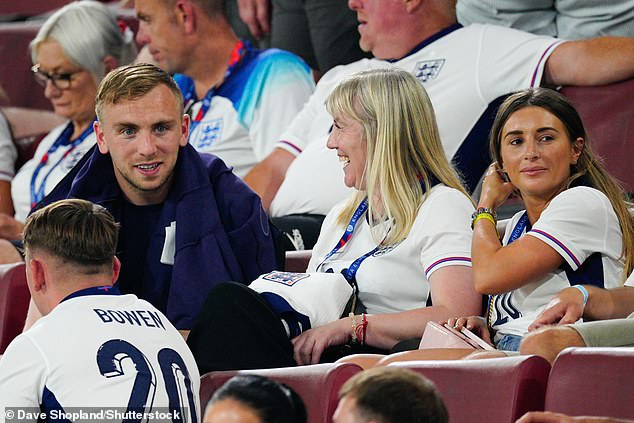 Jarrod Bowen (pictured left) sits with family and his partner Dani Dyer (right) after the match.