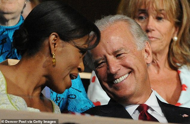 Joe Biden with Michelle Obama in the stands of the Pepsi Center during the second day of the Democratic National Convention on Tuesday, August 26, 2008 in Denver, Colorado