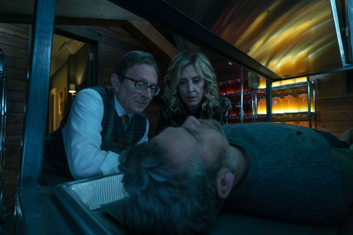 Dr.  Leland Townsend looks pleased over the unconscious Andy Bouchard, with his accomplice Sheryl next to him in the fourth season of the series Evil.