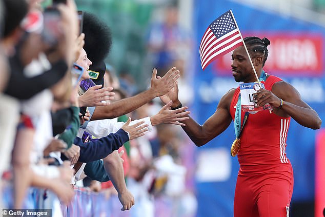 The US fans high-five after winning the 100m final at the US Olympic Trials