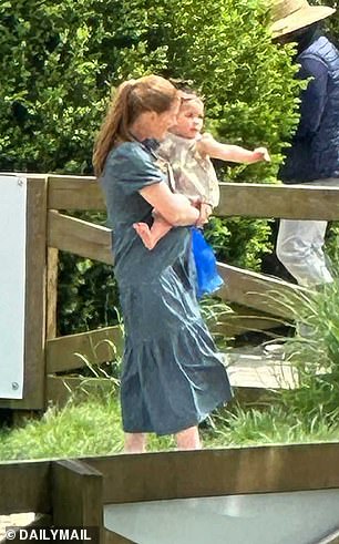 The 28-year-old's baby bump was previously visible under her flowing blue midi dress during a family day out