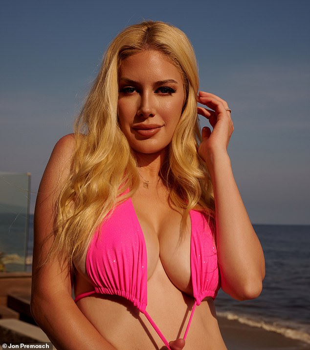 Heidi suggestively put on her bright pink bikini bra and stared into the camera lens