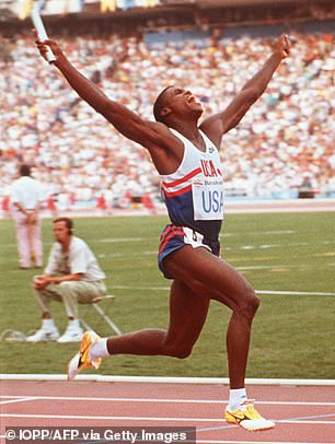 Lewis celebrates his victory in the men's 4x100m relay in 1992