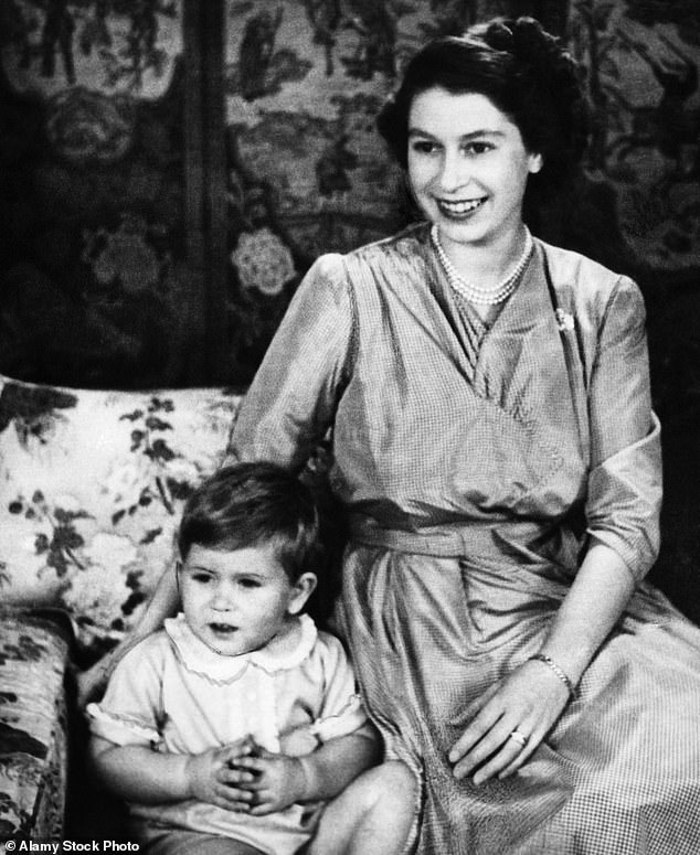 The late Queen smiled with little Prince Charles in 1950, when Elizabeth and Prince Philip's eldest son would have been around two years old