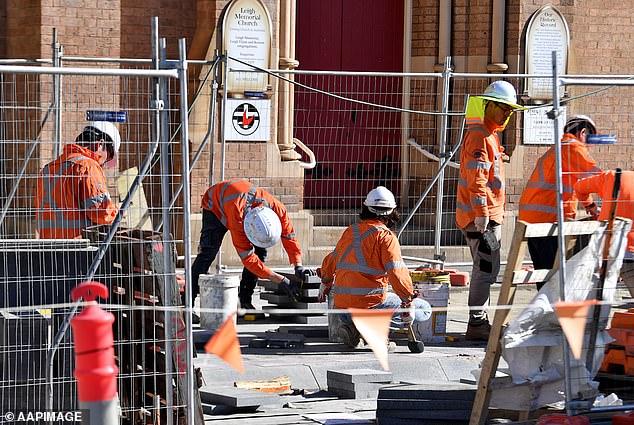 The federal government aims to build 1.2 million new homes in five years, which equates to 240,000 per year (pictured are construction workers in Sydney)