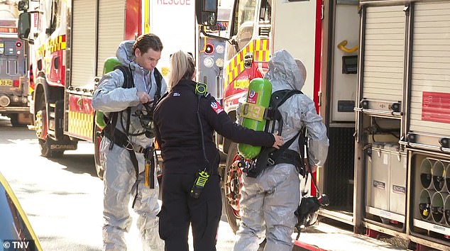 Firefighters and a hazardous materials team equipped with gas masks (pictured) searched the building and found the substance which was later deemed safe