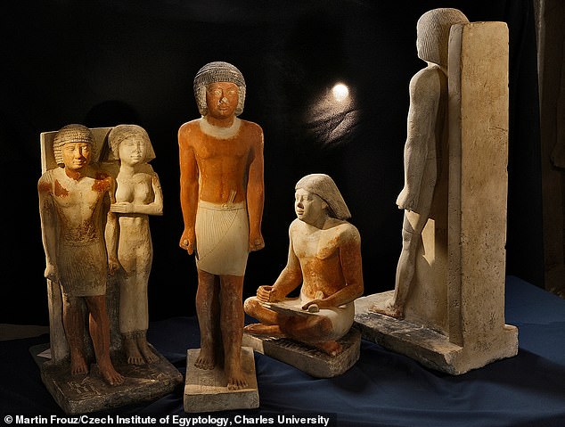 Repetitive tasks performed by Egyptian scribes (high-status men who could write and perform administrative tasks) and the positions they held while working may have led to degenerative skeletal changes, experts say. Pictured are statues of high dignitary Nefer, a scribe, and his wife in Abusir, Egypt