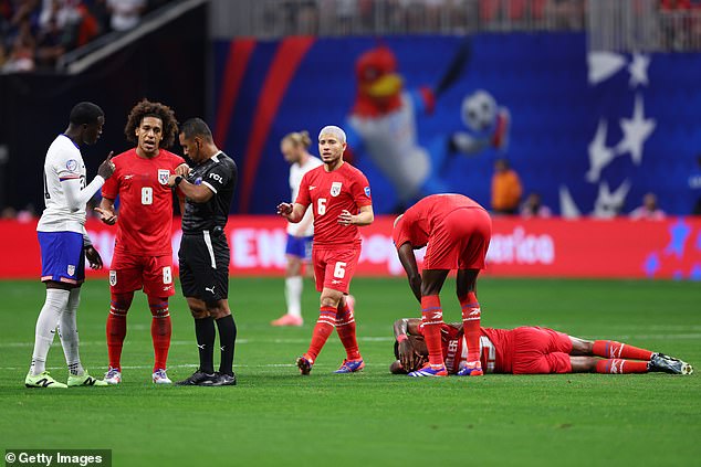 Panama's Roderick Miller reacts after making a foul as the referee finds his red card for Weah