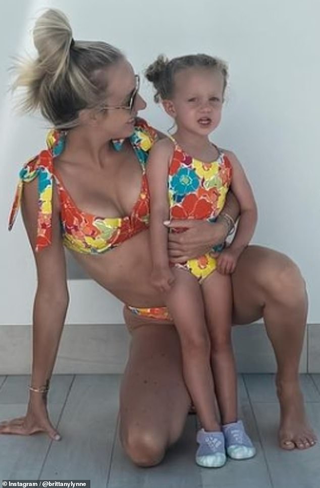 Brittany flashed a bikini as she posed for a photo with Sterling during the family vacation abroad