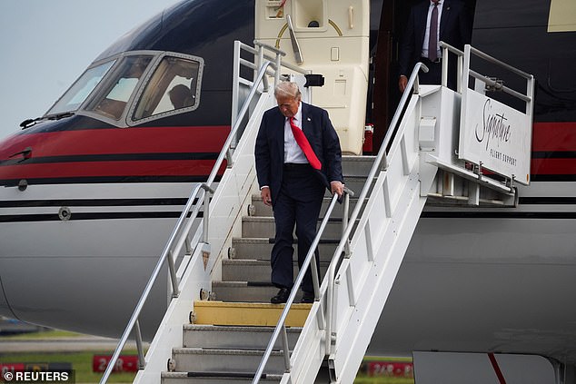 Donald Trump walks solo on Trump Force One as he arrived in Atlanta