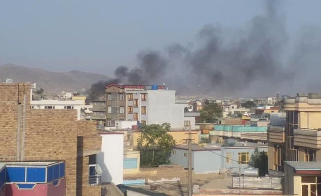 Smoke rises over Kabul from the explosion that killed 13 US soldiers and 90 Afghans