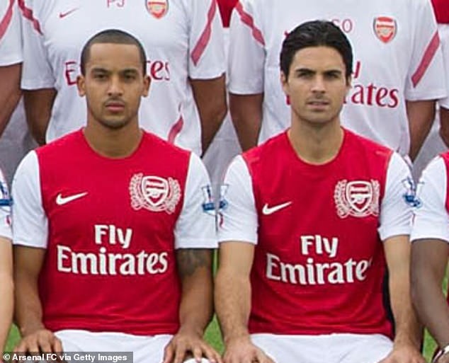 Arteta pictured next to Theo Walcott (left) in an Arsenal team photo from September 2011