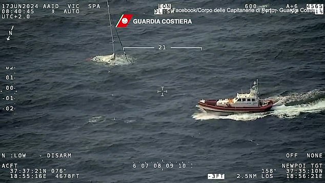 The Coast Guard vessel can be seen approaching the sinking yacht and disappearing underwater