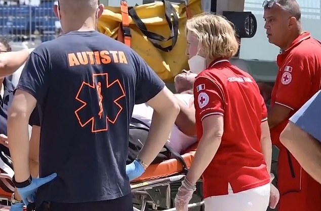 A survivor is being treated by medical teams after being rescued from the shipwreck on June 17