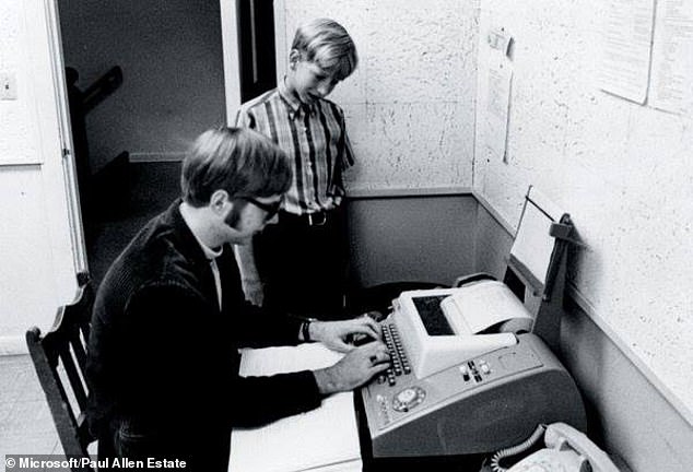 Bill Gates watches his friend and future Microsoft co-founder Paul Allen type on a teletype terminal at Lakeside School in 1968. Gates was about 13 in this photo