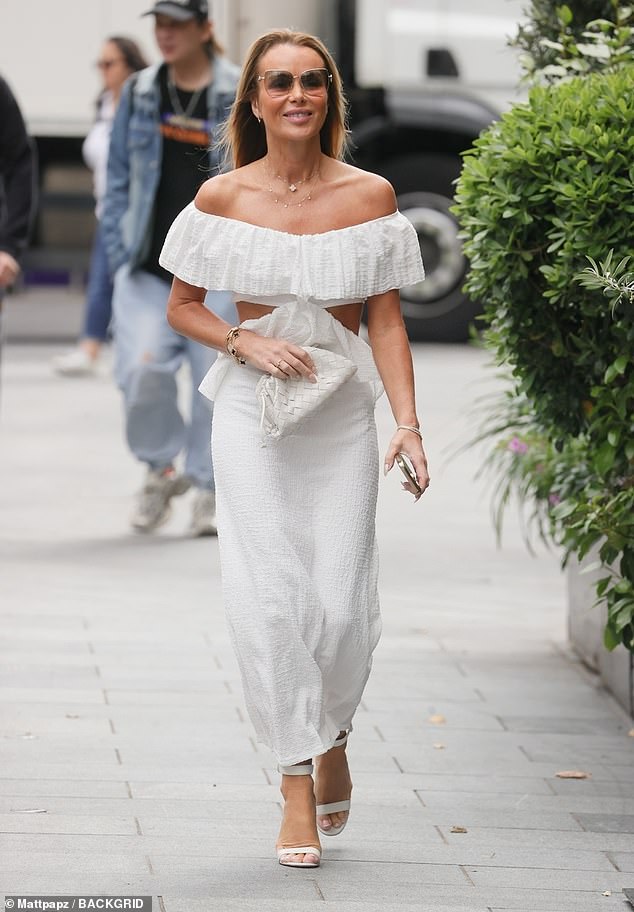 The Heart Breakfast host, 53, showed off her physique in the glamorous off-the-shoulder number, which drew attention to her slim frame with a cut-out midriff