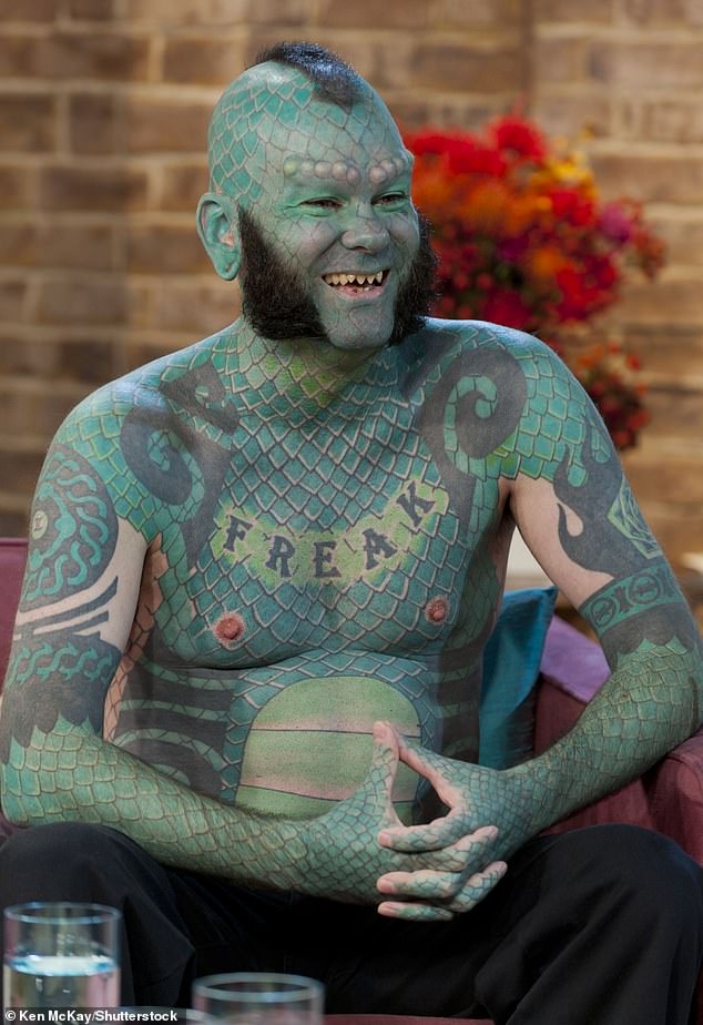 He spent almost 700 hours tattooing, had his teeth filed into fangs and had implants given to give him horns.  He's the Lizard Man