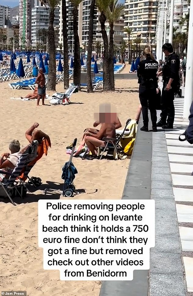 Police were filmed approaching the two men and then asking them to leave. It comes as Benidorm introduces a raft of fines to crack down on tourists, including a drink ban that could cost up to £635.