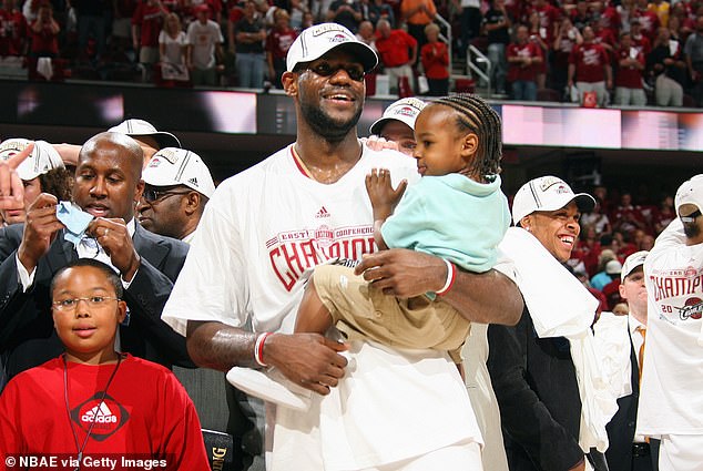 LeBron holds up Bronny after a win in the 2007 Eastern Conference Finals