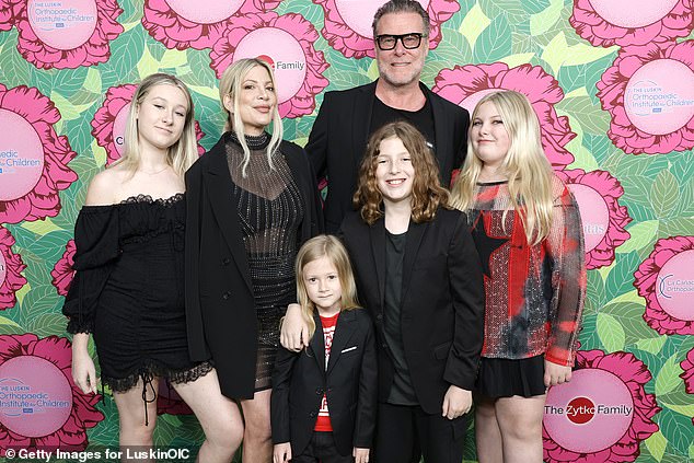 'There are two [placenta in the freezer]she told her listeners.  'Unless I have the biggest placenta in the world, there's two barrels in it' (seen last year with her children Liam, 17, Stella, 16, Hattie, 12, and Finn, 11, and Beau and his estranged husband Dean McDermott )