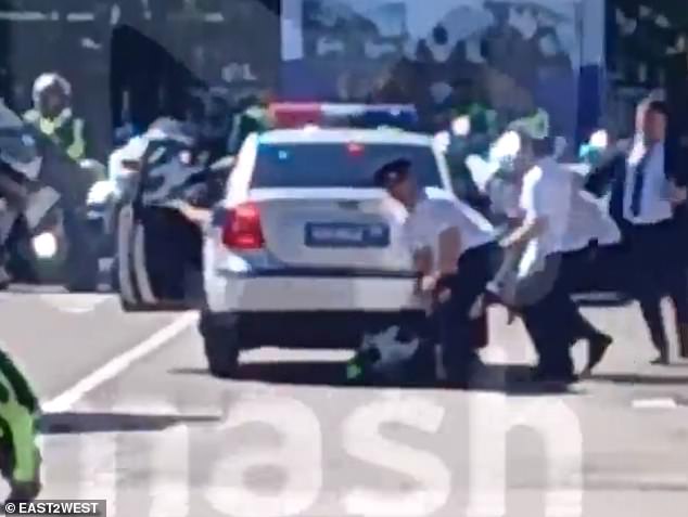 A separate clip shows other police officers running to the car to help the injured man.  He reportedly did not suffer any life-threatening injuries.
