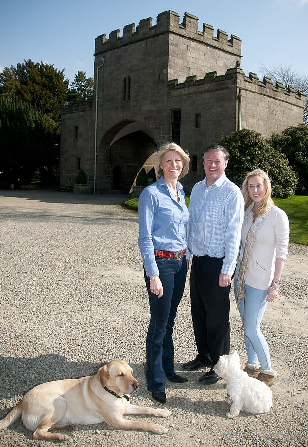 Sir Thomas Ingilby with his wife Emma and their daughter Eleanor and dogs outside their home in 2011