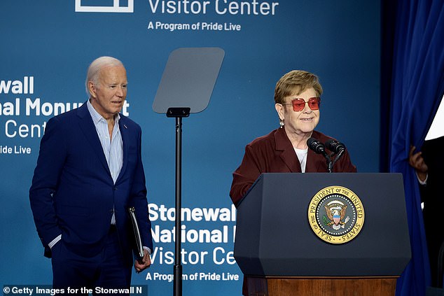 Elton John and President Joe Biden speak on stage during the grand opening ceremony of the Stonewall National Monument Visitor Center
