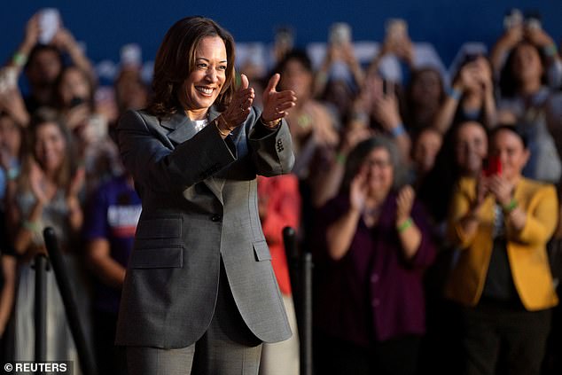 US Vice President Kamala Harris greets her audience on the campaign trail