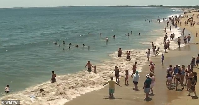 Maine officials are sounding the alarm about hazards at Old Orchard Beach (pictured) such as rip currents and erosion hazards