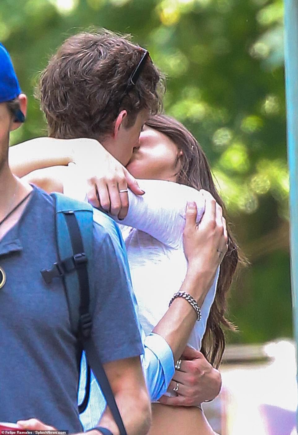 The teenage couple was seen kissing on the street during the day