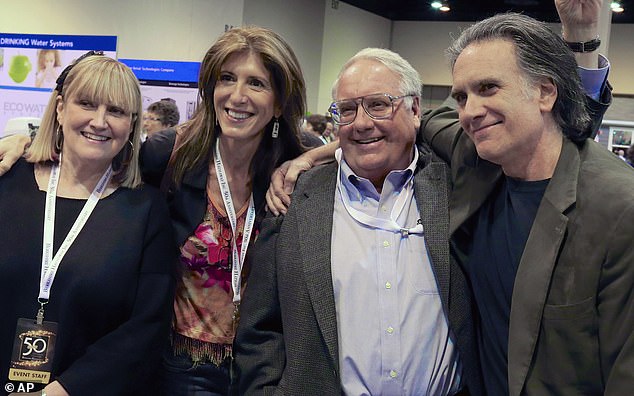 The chairman and chief executive of Berkshire Hathaway said that after his death, nearly all of his immense wealth will be put into a charitable trust, to be managed by his daughter and two sons; Pictured (far left) daughter Susan, (center right) son Howard, (far right) son Peter