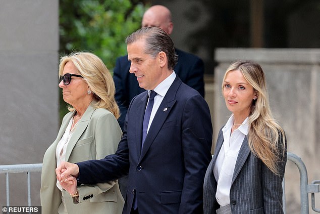 Jill Biden holds Hunter Biden's hand after he – and his wife Melissa Cohen (right) – leave the courthouse following his guilty verdict