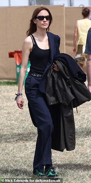 TV presenter Alexa, 40, covered her modesty with navy blue trousers and held on to her jacket despite the warm weather