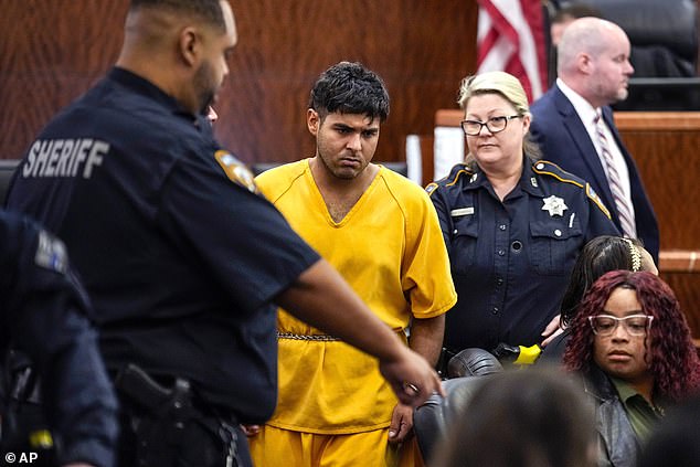 Johan Jose Martinez-Rangel, one of two men accused of killing 12-year-old Jocelyn Nungaray, is led out of the courtroom by officers on Tuesday