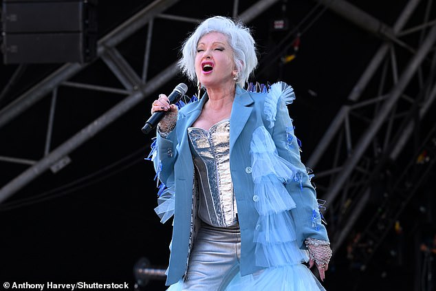 Cyndi looked stunning during the afternoon performance as she donned a silver corset with matching trousers and a blue ruffled long coat