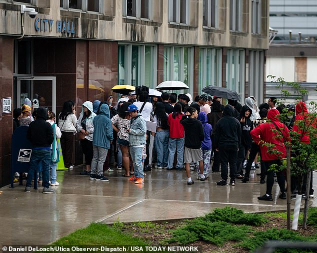 A crowd gathers outside City Hall for the press conference in Utica, NY on Saturday, June 29, 2024