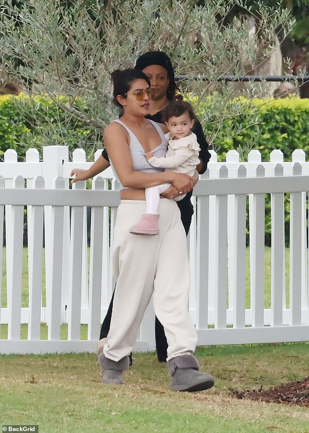 While cradling their adorable daughter Malti Marie, Priyanka looked every bit the doting mother