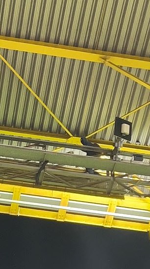 The masked man walked over the beam just inside the roof after the final whistle of the match between Germany and Denmark