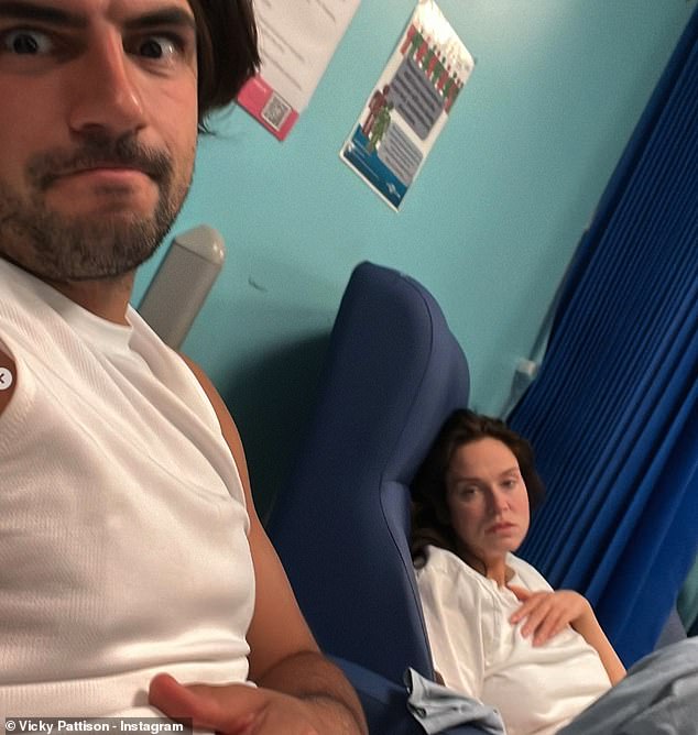 Vicky was supported at her bedside by fiancé Ercan Ramadan, 30, but put her upcoming summer wedding in doubt after saying she would have to stay in hospital 'for a while'
