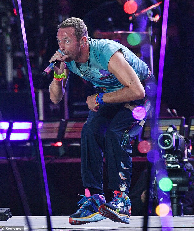 Coldplay made history when they became the first group ever to play Glastonbury five times on Saturday (frontman Chris Martin pictured)