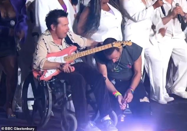 The 63-year-old Back To The Future actor, who is battling Parkinson's disease, appeared on stage in his wheelchair while playing guitar