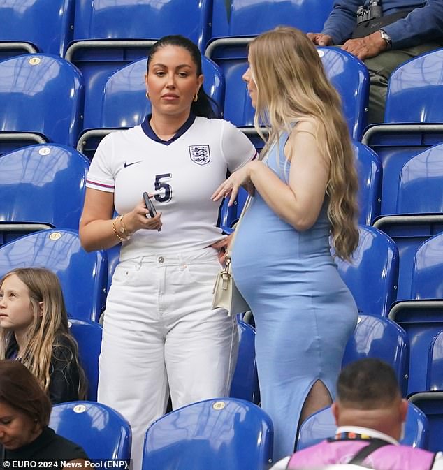 Olivia Naylor, the girlfriend of defender John Stones, chatted with another spectator before the match