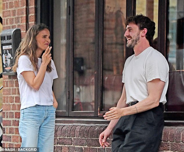 Paul and Natalie couldn't contain their giggles as they enjoyed a night out drinking at Bar 69 in Islington last month, although sources have said they are just friends