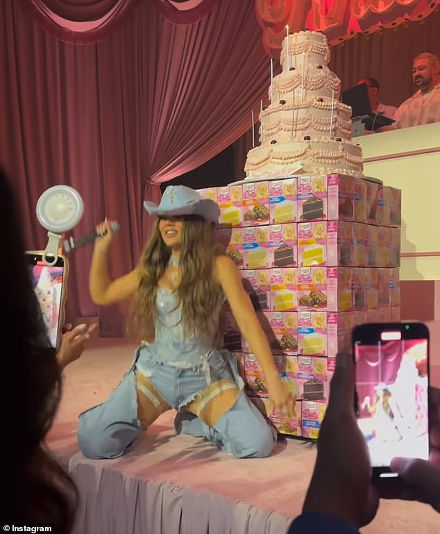 The cake sat on a stand made from boxes of Dolly Parton-inspired Duncan Hines cake mixes