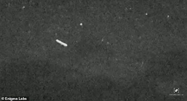 A bright white, glowing UFO – in the classic 'cigar' shape common to these sky mysteries – was captured on military night vision this month by a Montana resident (above)