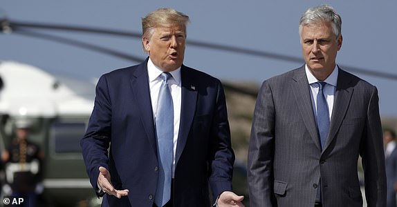 President Donald Trump and Robert O'Brien, just named as the new National Security Advisor, walk to speak to the media at Los Angeles International Airport on Wednesday, September 18, 2019.  (AP Photo/Evan Vucci)
